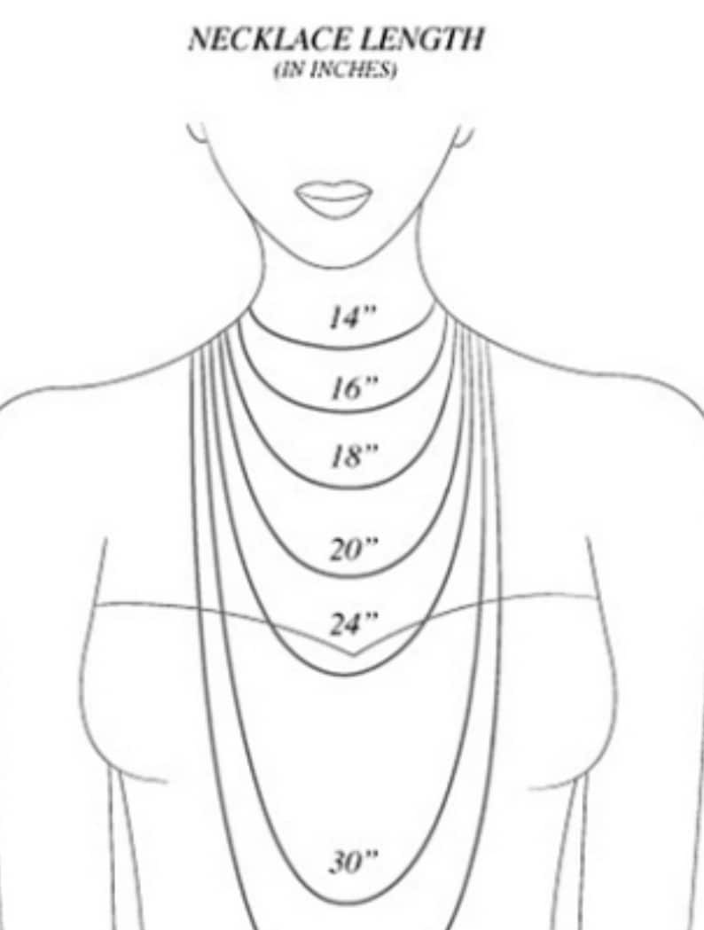 May include: A line drawing of a person's neck with different necklace lengths marked in inches, starting at 14 inches and increasing in increments of 2 inches up to 30 inches.