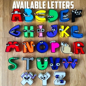 May include: Colorful alphabet letters in various colors, including red, blue, yellow, and green, arranged on a wooden surface. The letters have cartoon-like features and the text "AVAILABLE LETTERS" is at the top.