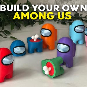 Könnte beinhalten: Baue deine eigenen Among Us Charaktere mit diesem Set aus 3D-gedruckten Figuren. Das Set enthält rote, orange, blaue, lila, rosa und grüne Charaktere sowie ein Knochen-Accessoire.