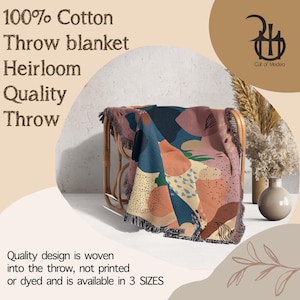 May include: A colorful throw blanket made of 100% cotton. The blanket features a woven design with abstract shapes in shades of pink, blue, orange, and yellow. The text "Quality design is woven into the throw, not printed or dyed and is available in 3 SIZES" is visible at the bottom of the image.