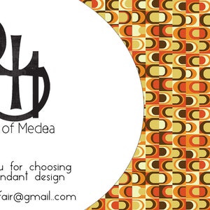 May include: A business card with a black and white logo that says "Cult of Medea" and a geometric pattern in shades of orange, brown, and yellow.