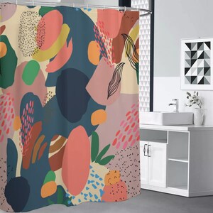 May include: A shower curtain with an abstract design. The curtain features a pattern of colorful shapes in shades of teal, coral, pink, and yellow. The design includes dots, lines, and organic forms, creating a modern and artistic look.