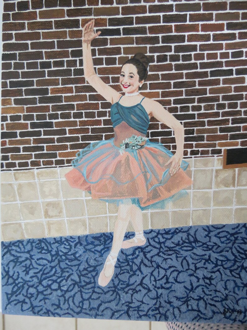 May include: A painting of a young girl wearing a pink and blue tutu, standing in front of a brick wall. She is wearing white ballet shoes and has her arm raised in the air.