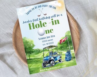 May include: A golf-themed birthday invitation with a watercolour illustration of a golf buggy, golf clubs, and a golf ball. The text reads "Swing on by and enjoy the fun. Jonah's first birthday will be a Hole-in-One. Saturday June 10th, 55555 Gratiot, City, MI 55555. RSVP Kayla (555) 555-5555."