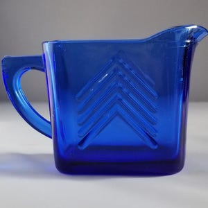 Cobalt blue depression glass creamer by Hazel Atlas Glass showcasing an Art Deco design