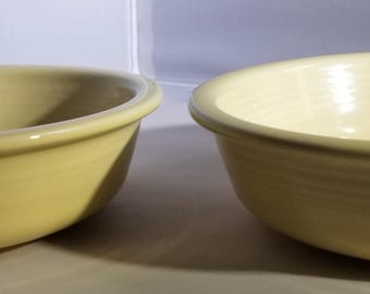 Cream colored early Fiestaware bowls made by Homer Laughlin Company