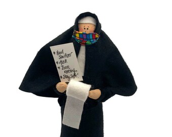 Nun doll, sister doll, woman with list for pandemic, wearing mask, religious humor, holding toilet paper, Sister Pandemica, 2020 memento