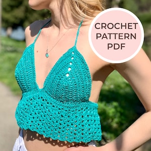 May include: A teal crochet halter top with a scalloped hem. The top is made with a delicate open stitch pattern. CROCHET PATTERN PDF.