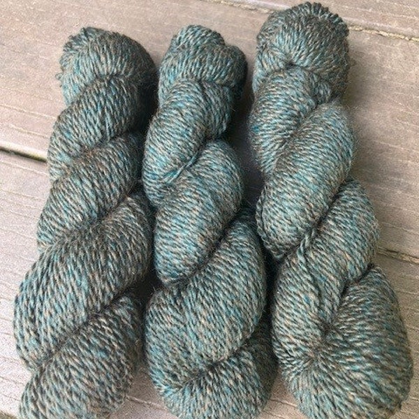 Natural Alpaca yarn blended with teal Merino and bamboo in 2ply sport weight
