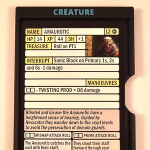 May include: A black and white character card for a tabletop role-playing game. The card features a creature called "Amaurotic" with a description of its abilities and a graphic of a blindfolded person. The card also includes two blue dials with numbers 1-9.
