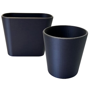 May include: Two black, cylindrical planters. The larger planter is rectangular and the smaller planter is round.