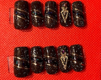 Uñas postizas con purpurina negra