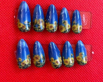 blauwe zonnebloempers op nagels