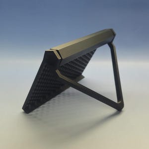 May include: A black, angled phone stand with a textured surface. The stand is supported by a thin, angled leg. The background is a gradient of blue and white.