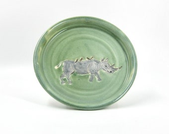 African Rhino and Oxpecker Birds on a Light Green Wheel-thrown Porcelain Plate