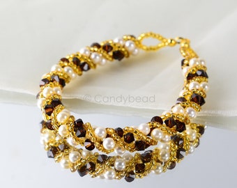 Crystal swarovski bracelet; glass bracelet; Pearl and gold twisty swarovski bracelet, size 8 inches and 2 inches adjustable chain