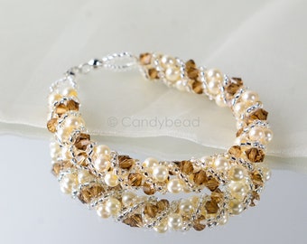 Crystal swarovski bracelet; glass bracelet; Brown gold twisty swarovski pearl bracelet, size 7 inches and 2 inches adjustable chain