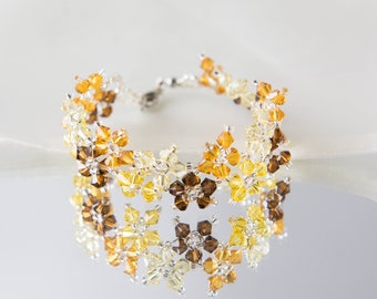 Crystal swarovski bracelet; Shade of yellow multiflora swarovski bracelet, size 7 inches and 2 inches adjustable chain