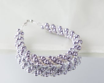 Crystal swarovski bracelet; glass bracelet; Gray twisty swarovski bracelet, size 8 inches and 2 inches adjustable chain