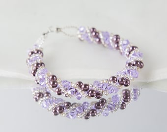 Crystal swarovski bracelet; glass bracelet; purple and lavender twisty swarovski bracelet, 8 inches and 2 inches adjustable chain