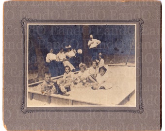 A Day at the Park - Late 1800s Cabinet Card of Children Playing in a Sandbox - Parents Sitting on a Bench in the Background