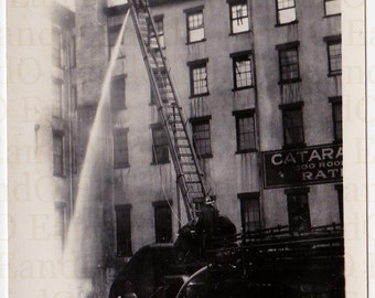 Antique Snapshot of a Fire Engine, Fire Fighters Spraying a Building With a Water Hose 1930s