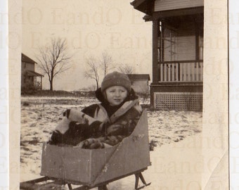 Antique Photo "It's Too Cold Outside" Little Boy Bundled up in a Home Made Basket for a Sled - He Looks Cold and Uncertain