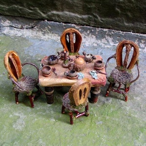 Fae table with chairs and tea service