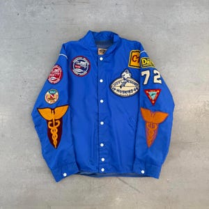 May include: A set of three ceramic mugs with a speckled, matte finish. The mugs are in shades of cream, light grey, and dark grey. Each mug has a simple, minimalist design, ideal for coffee or tea.