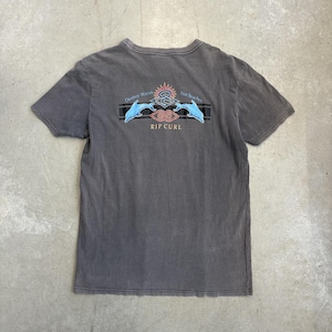 May include: A charcoal gray t-shirt with a graphic on the back. The graphic includes the text "Destroy Waves Not Beaches" above a stylized sun and wave design with the brand name "RIP CURL" below.
