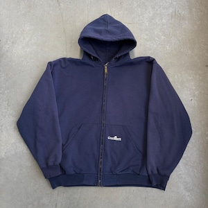 May include: A navy blue zip-up hooded sweatshirt featuring a full-length metal zip, long sleeves, and a front kangaroo pocket. The word Carhartt is embroidered in white thread on the lower right side of the front pocket area.
