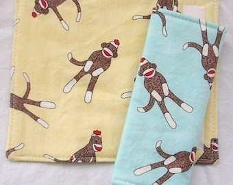 Reversible Car Seat Strap Covers - Tossed Sock Monkeys on Yellow and Aqua