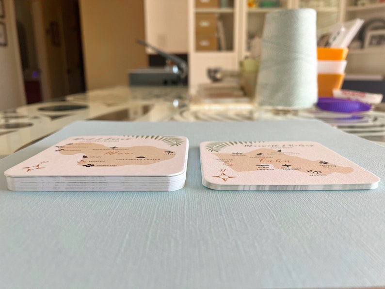 Left coasters are DOUBLE thick smooth paper. Right PAPER coasters are printed on 110# cover stock with a felt finish.  Both are stacks of 10 coasters each, for you compare.