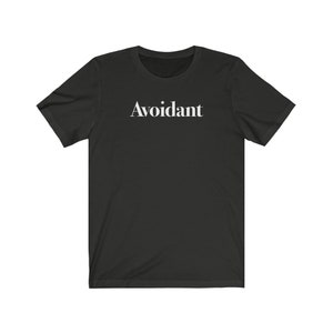 May include: Black t-shirt with the word "Avoidant" printed in white on the front.