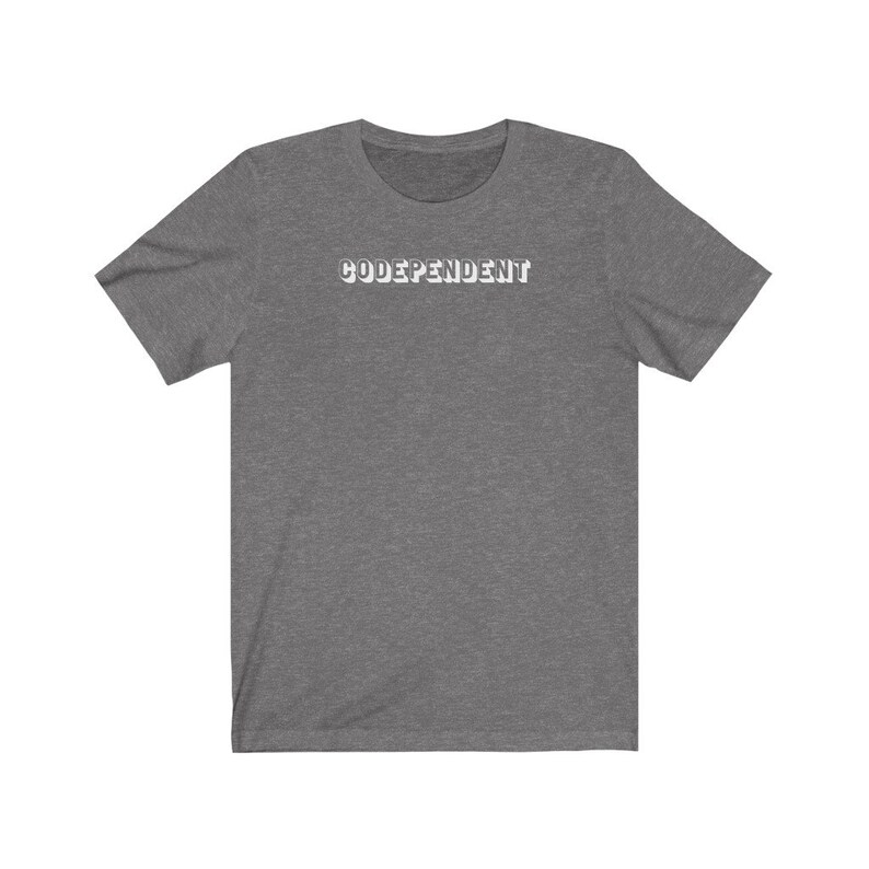 May include: A heather gray short-sleeved t-shirt with the word "CODEPENDENT" printed in white on the front.