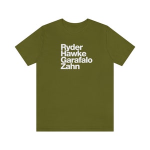 May include: A green t-shirt with the names Ryder, Hawke, Garafolo, and Zahn printed in white on the front.
