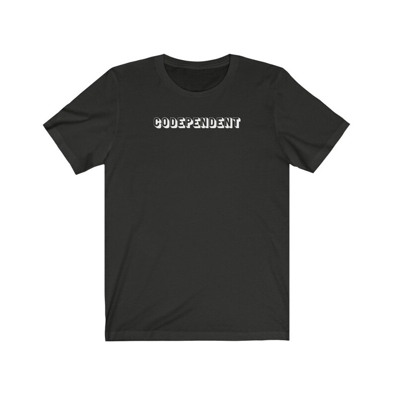 May include: Black short-sleeved t-shirt with the word "CODEPENDENT" printed in white on the front.