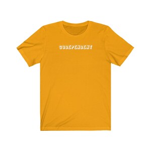 May include: A yellow short-sleeved t-shirt with the text "CODEPENDENT" printed in white on the front.