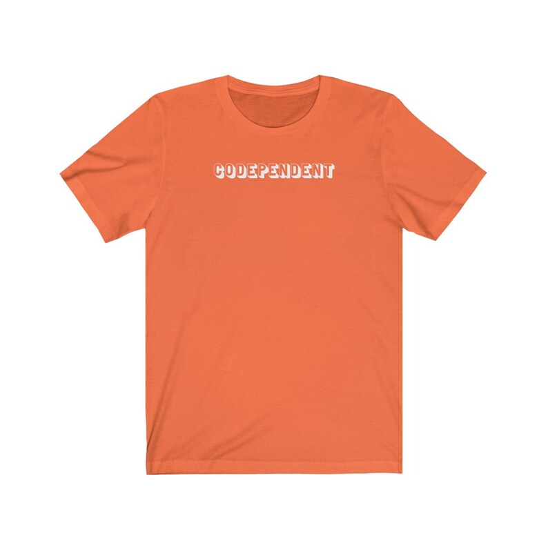 May include: Orange short-sleeved t-shirt with the text "CODEPENDANT" printed in white on the front.