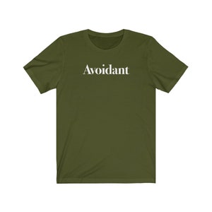May include: A green short-sleeved t-shirt with the word "Avoidant" printed in white on the front.