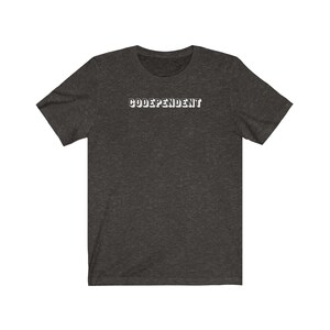 May include: A dark heather grey t-shirt with the text "CODE-DEPENDENT" printed in white on the front.