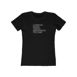 May include: Black women's t-shirt with white text that reads "LONDON PARIS TOKYO GREENWICH VILLAGE"