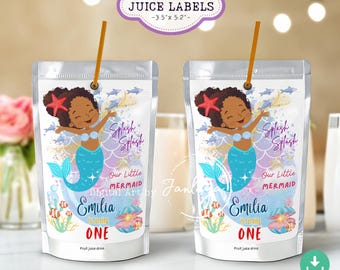 May include: Two juice pouches with mermaid-themed labels. Each label features a cartoon mermaid with a red starfish, blue tail, and the text "Splash Splash." The labels also include the name "Emilia" and the phrase "is turning ONE."
