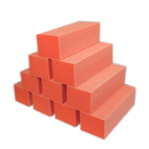 May include: A collection of ten orange rectangular nail buffer blocks. Each block has a consistent colour and shape, with a slightly porous texture. The blocks are arranged in a pyramid shape, against a white background.