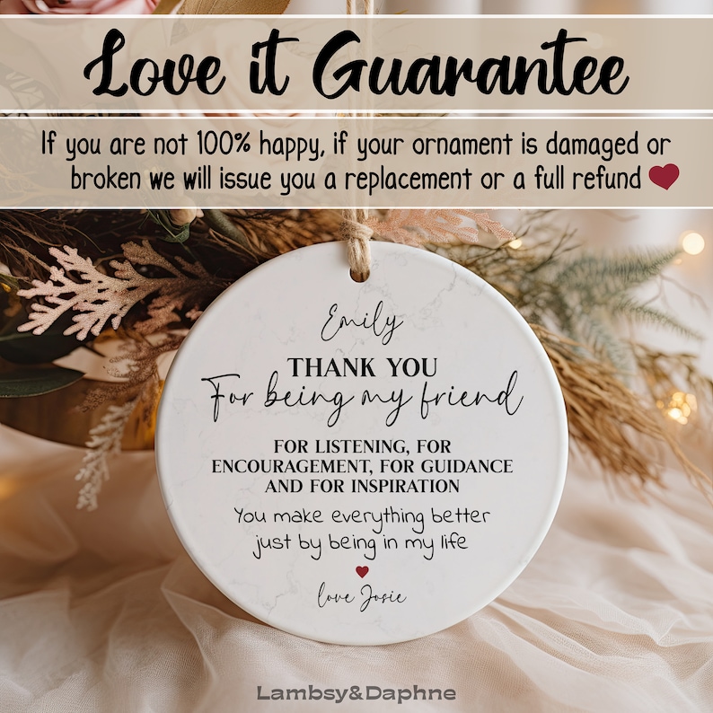 May include: White ceramic ornament with a marbleized design. The ornament features the text "Thank You For Being My Friend" with the names "Emily" and "Josie" and a red heart. The ornament is a gift for a friend.