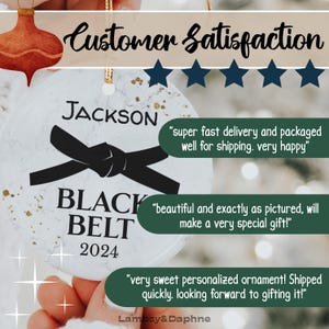 May include: White ceramic ornament with a black belt design, the text "JACKSON BLACK BELT 2024" and customer reviews.