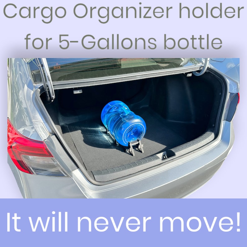 May include: A blue 5-gallon water bottle is secured in the boot of a car using a black cargo organiser holder. The text "Cargo Organizer holder for 5-Gallons bottle" is at the top of the image. The text "It will never move!" is at the bottom of the image.