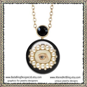May include: A gold chain necklace with a black pendant featuring a white eye surrounded by pearls. The pendant is round and has a black background. The necklace is a unique jewelry design.