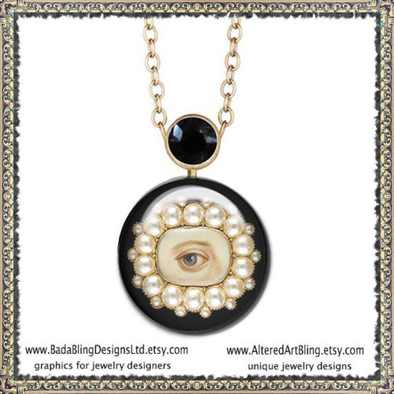 May include: A gold chain necklace with a black pendant featuring a white eye surrounded by pearls. The pendant is round and has a black background. The necklace is a unique jewelry design.