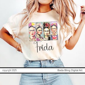 May include: A cream-coloured t-shirt displaying a graphic of four Frida Kahlo portraits, each adorned with floral headpieces. The cursive word "Frida" is below. The t-shirt is worn by a person.